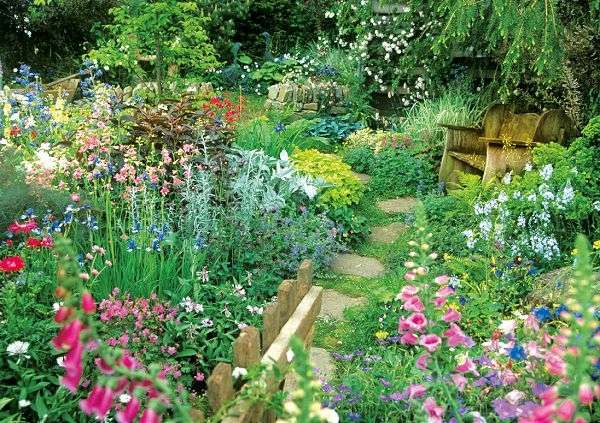 Ein bunter Garten am Haus Puzzlespiel online