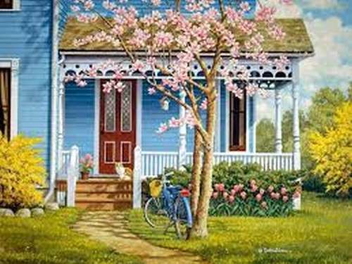 una casa con un albero in fiore puzzle online