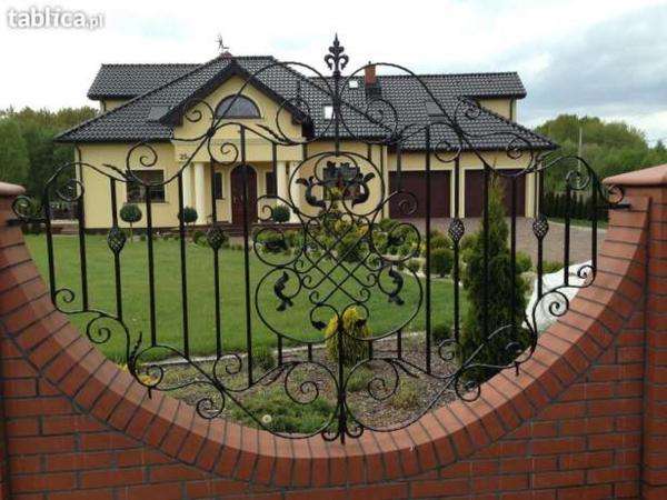 cottage with a wrought iron fence online puzzle