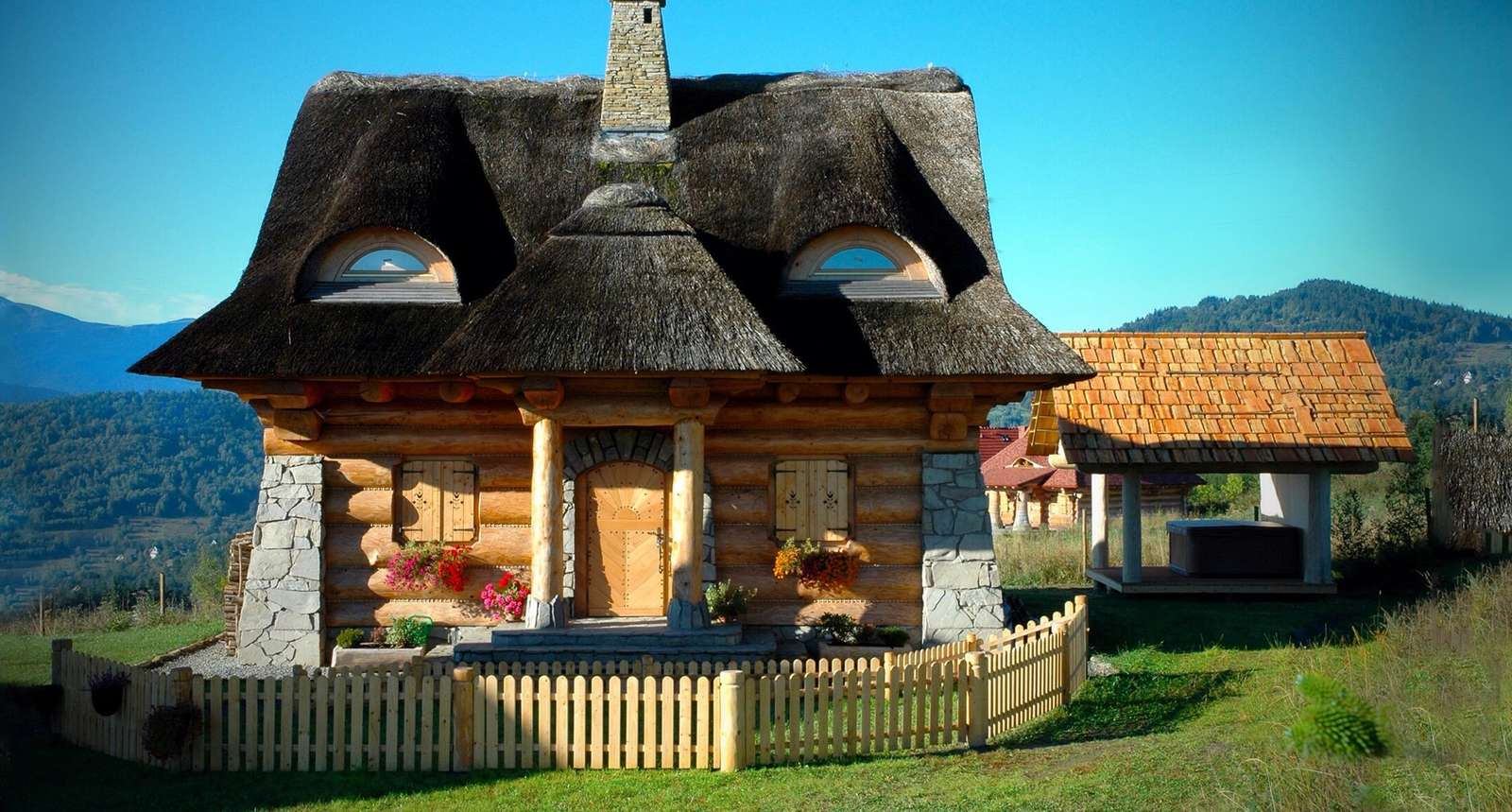Ein Haus mit Strohdächern Online-Puzzle