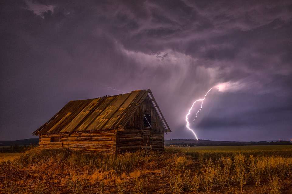 Lightning over an old barn. jigsaw puzzle online