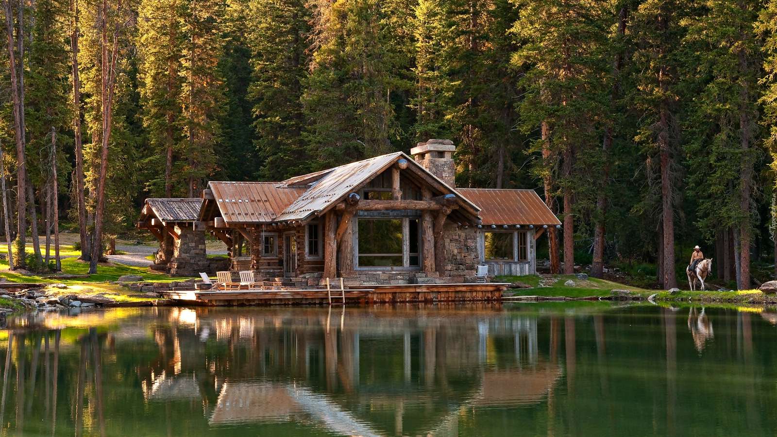 Uma casa à beira do lago. puzzle online