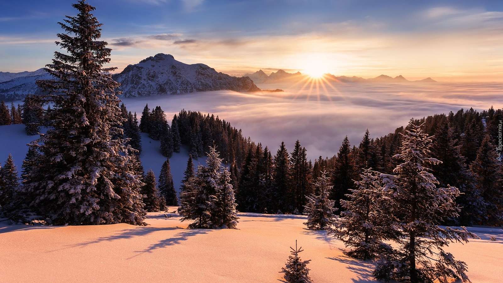 Téli napkelte a hegyekben online puzzle