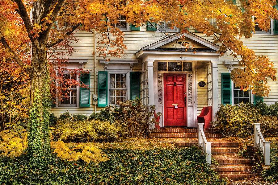 A casa está envolvida em cores de outono quebra-cabeças online