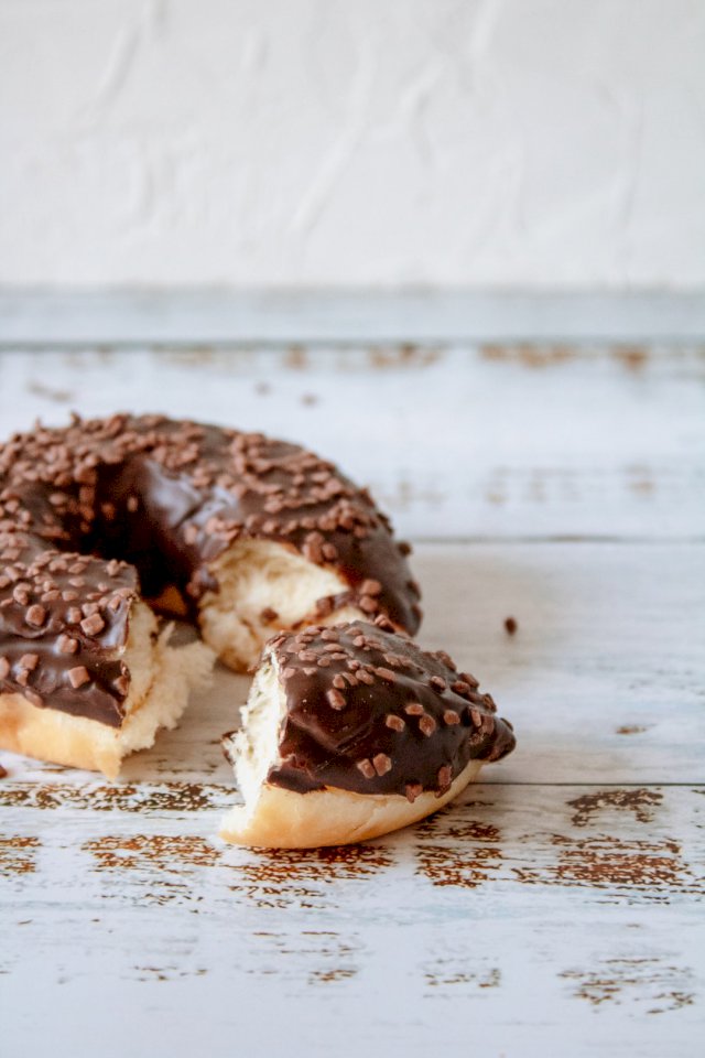 Tasty chocolate donut on white online puzzle