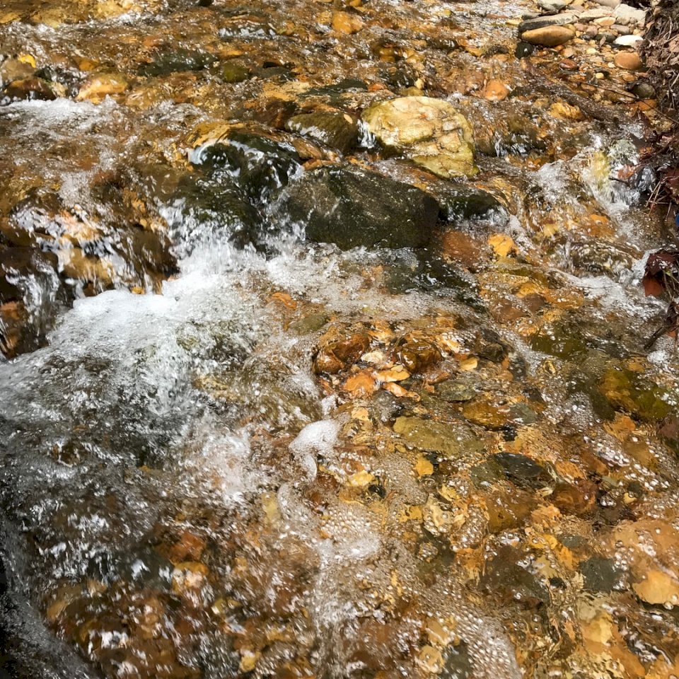 Stream water flowing over online puzzle