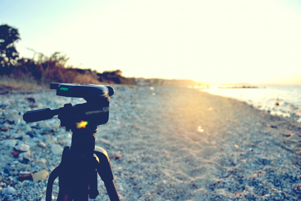 Camera tripod on a beach jigsaw puzzle online