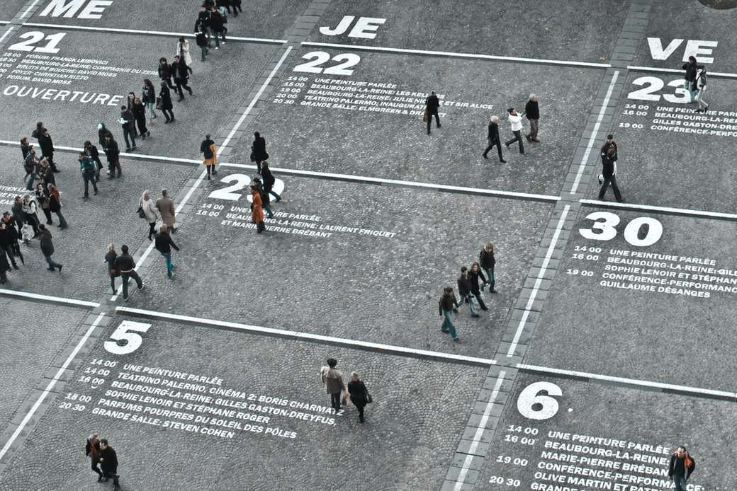 people walking on the road during day time jigsaw puzzle online