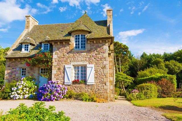 Small House Surrounded By Flowers jigsaw puzzle online