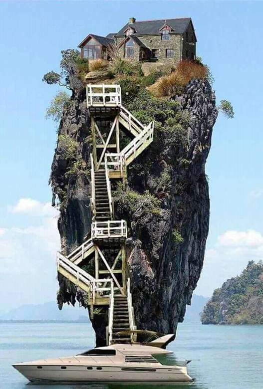 високий острів скель з будинком на вершині пазл онлайн