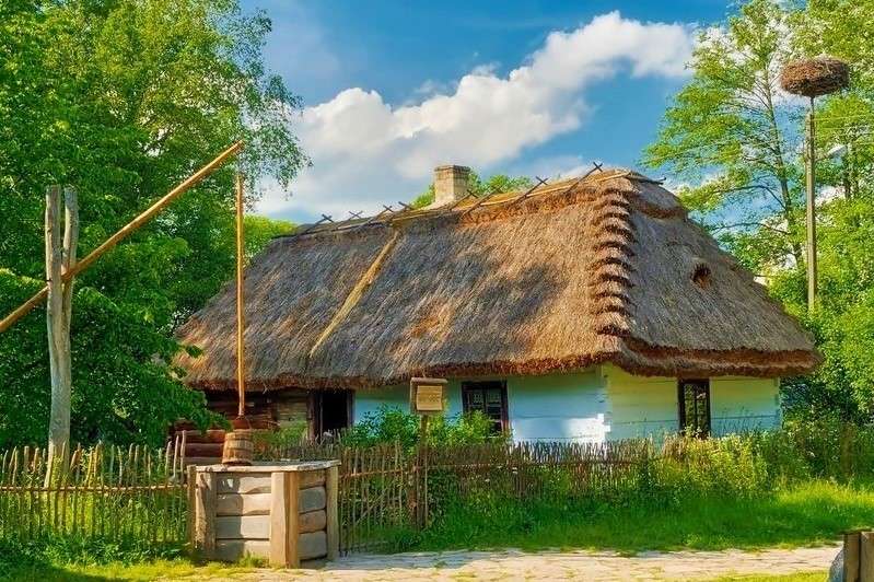 Cottage Village avec nid de cigogne puzzle en ligne