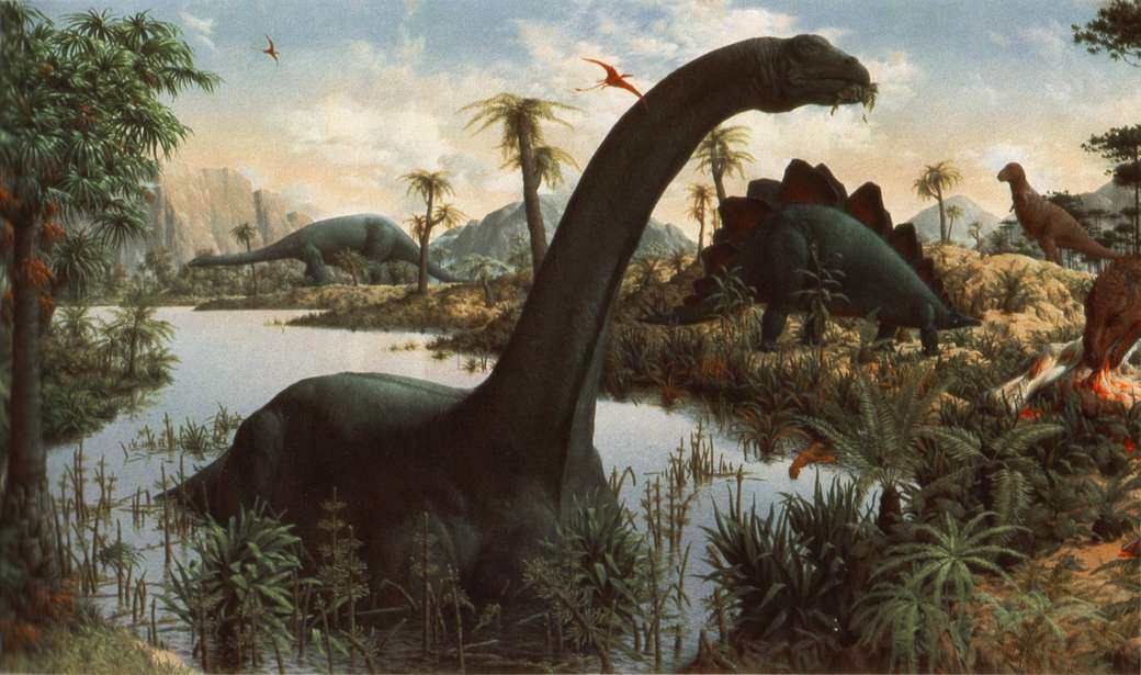 De dinosaurus baadt in een plas en eet online puzzel