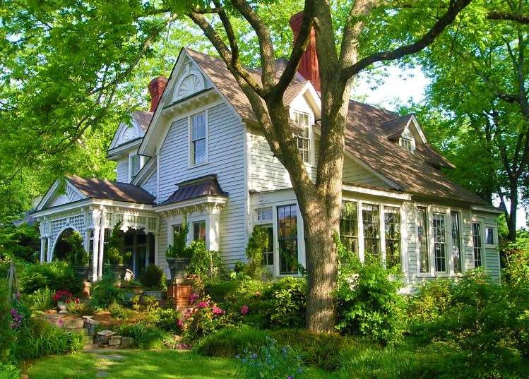 House Surrounded By Trees And Flowers online puzzle