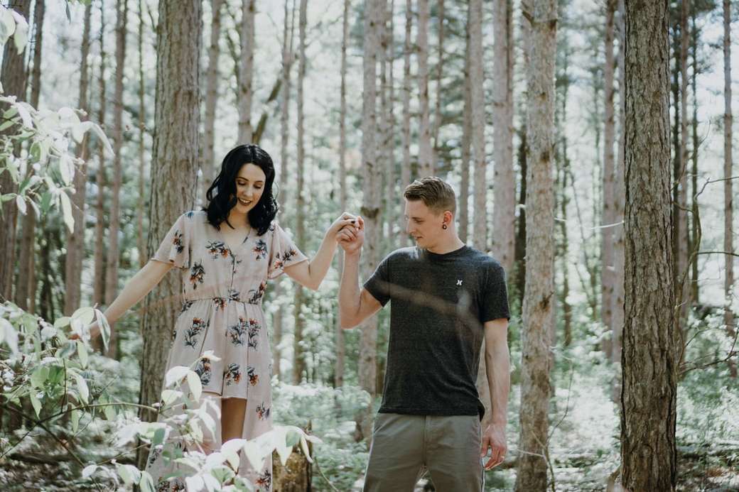 man holding hands with woman near trees jigsaw puzzle online