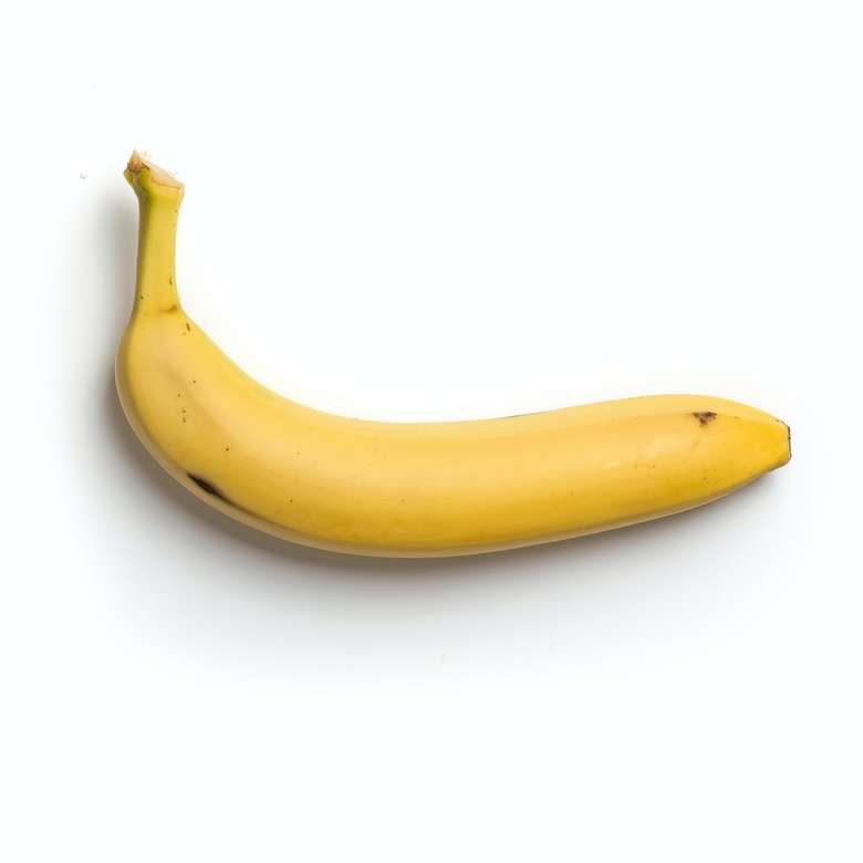plátano amarillo sobre fondo blanco rompecabezas en línea