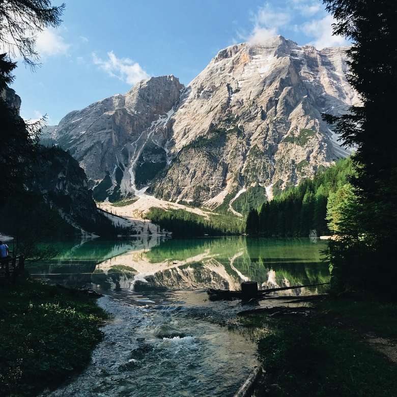 body of water near mountain jigsaw puzzle online