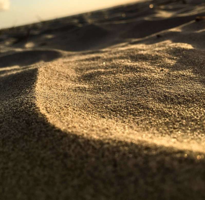 Sand i solen pussel på nätet