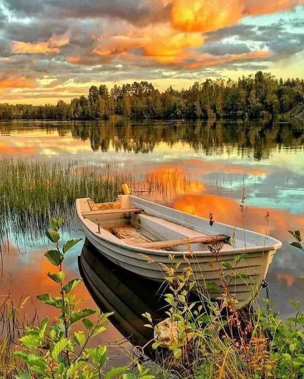 en bateau jusqu'au lac au coucher du soleil puzzle en ligne
