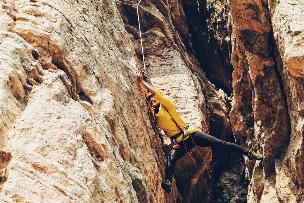 person climbing on the rock jigsaw puzzle online