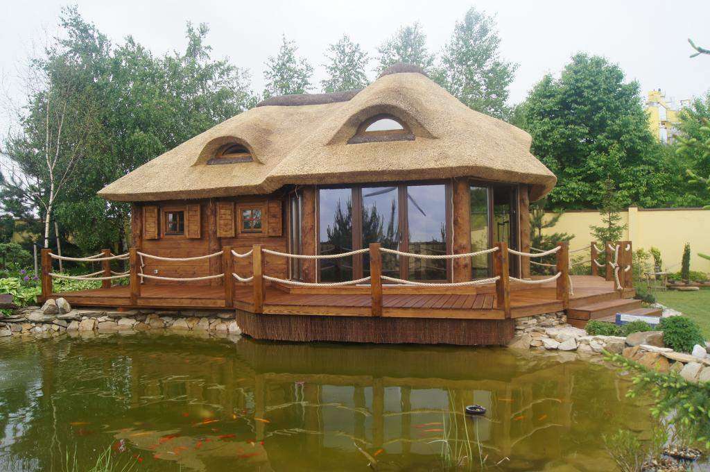 casa in legno in riva al lago puzzle online