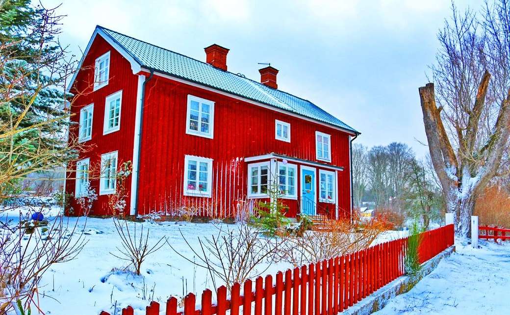 Rood blokhuis in de winter in Zweden legpuzzel online