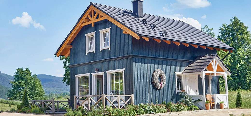 casa di legno blu in Norvegia puzzle online