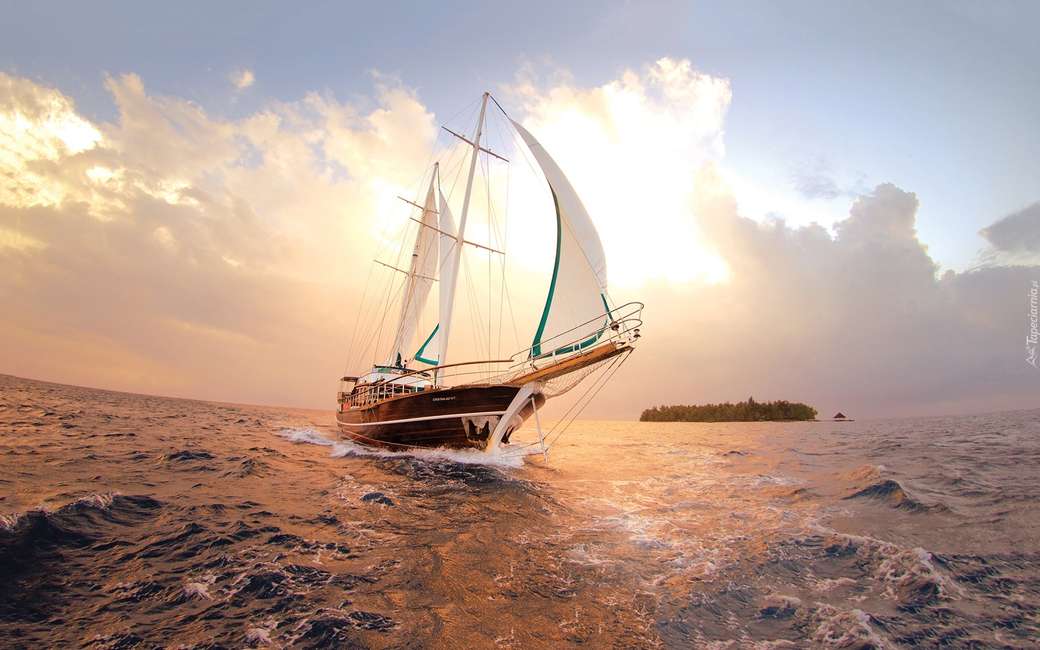 yacht en mer - coucher de soleil puzzle en ligne