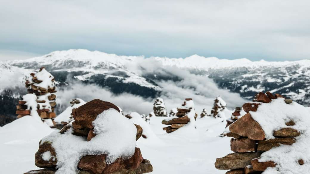 snow-covered cairns overlooking mountains online puzzle