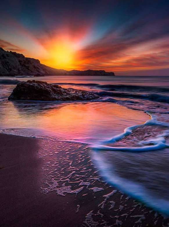 Wunderschöner Sonnenuntergang am Meer Puzzlespiel online