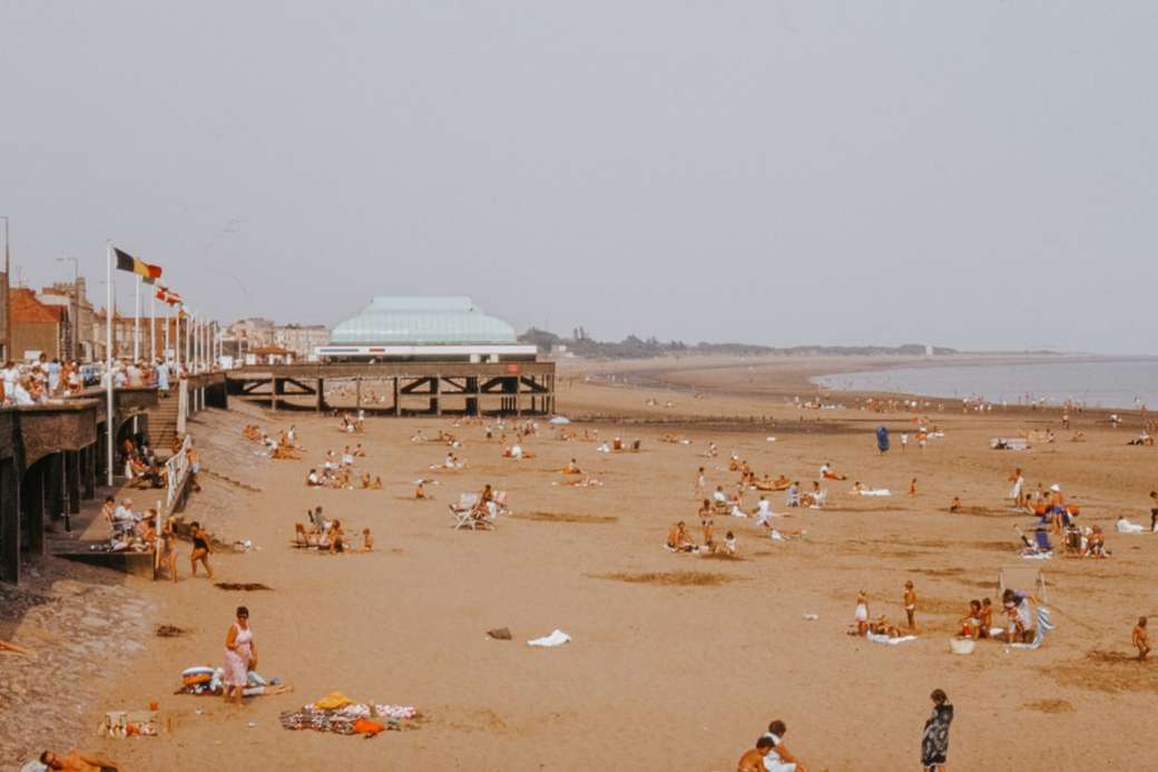 Vintage British seaside beach scene with pier jigsaw puzzle online