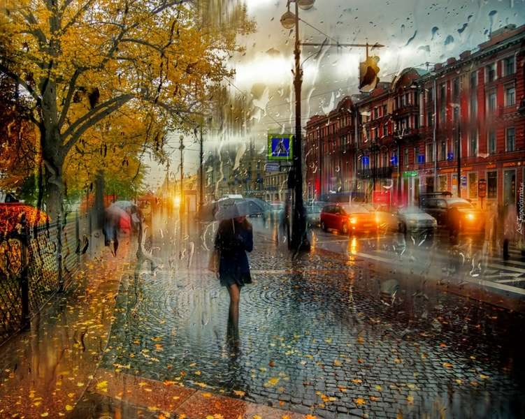 Frau mit Regenschirm auf der Straße Online-Puzzle