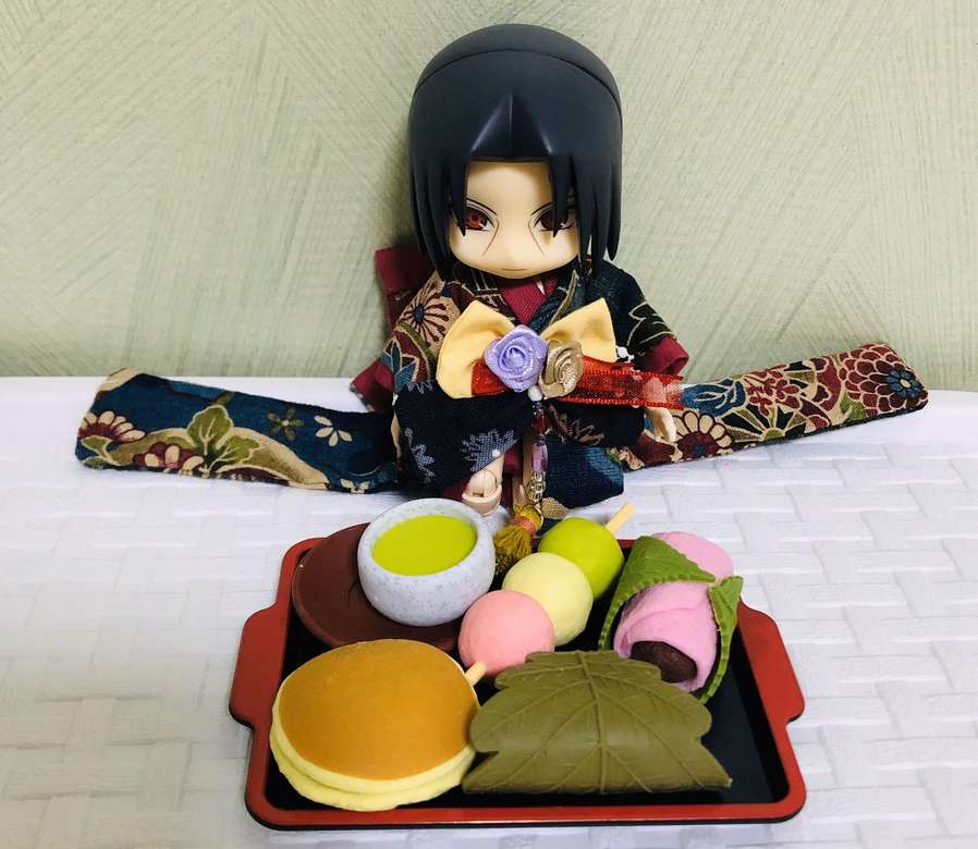Itachi in front of Japanese pastries jigsaw puzzle online