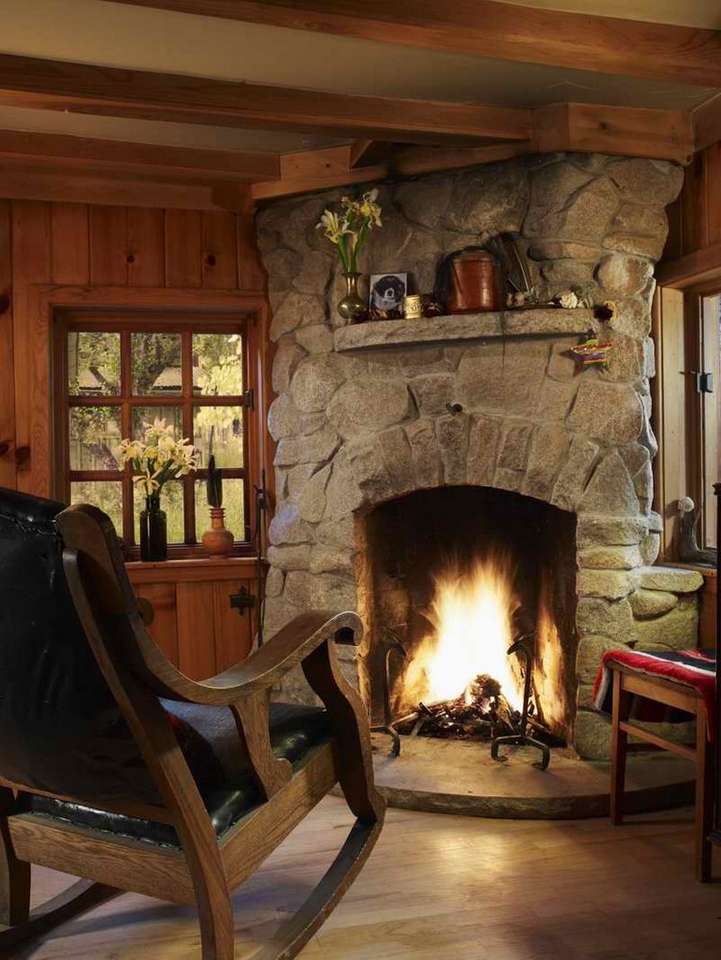 Log cabin rocking chair in front of a fireplace jigsaw puzzle online