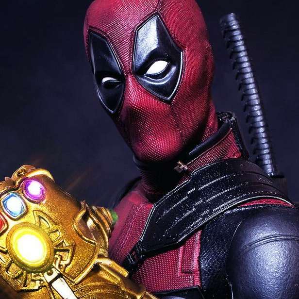 Deadpool med en thanosa handske Pussel online