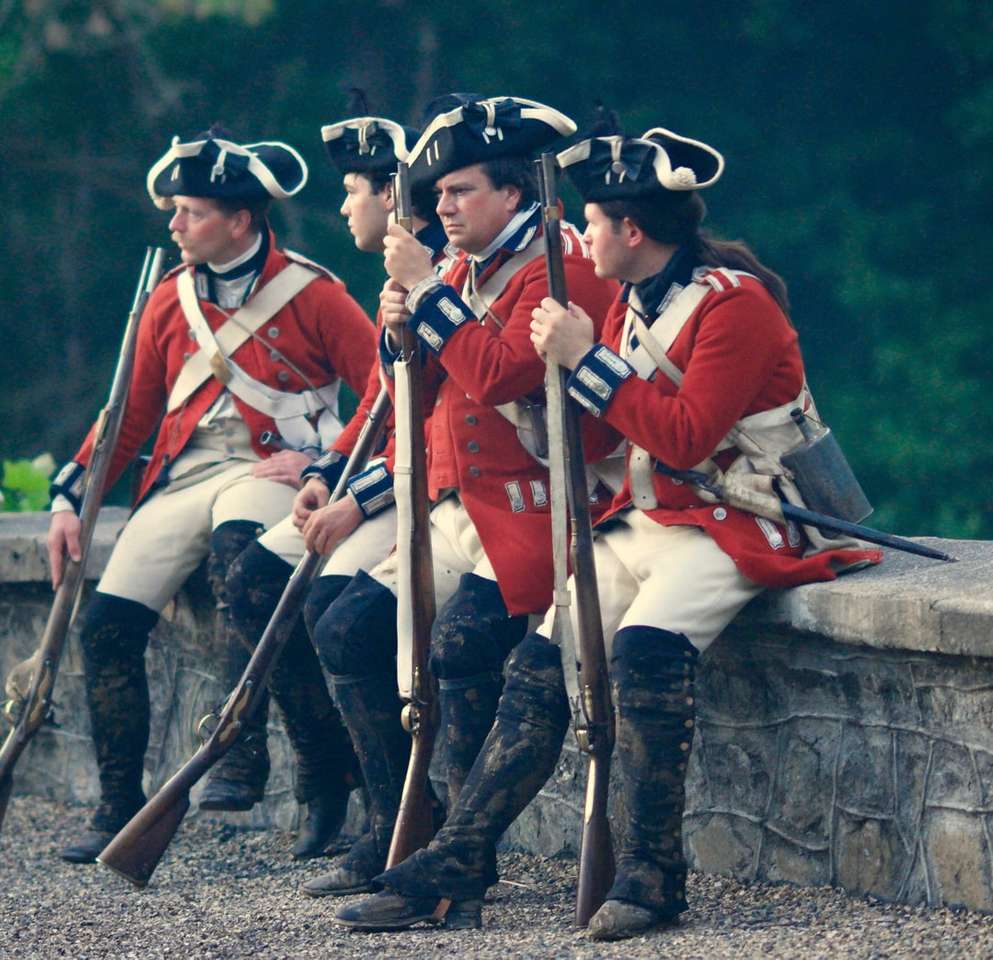 four men in uniforms holding rifles jigsaw puzzle online