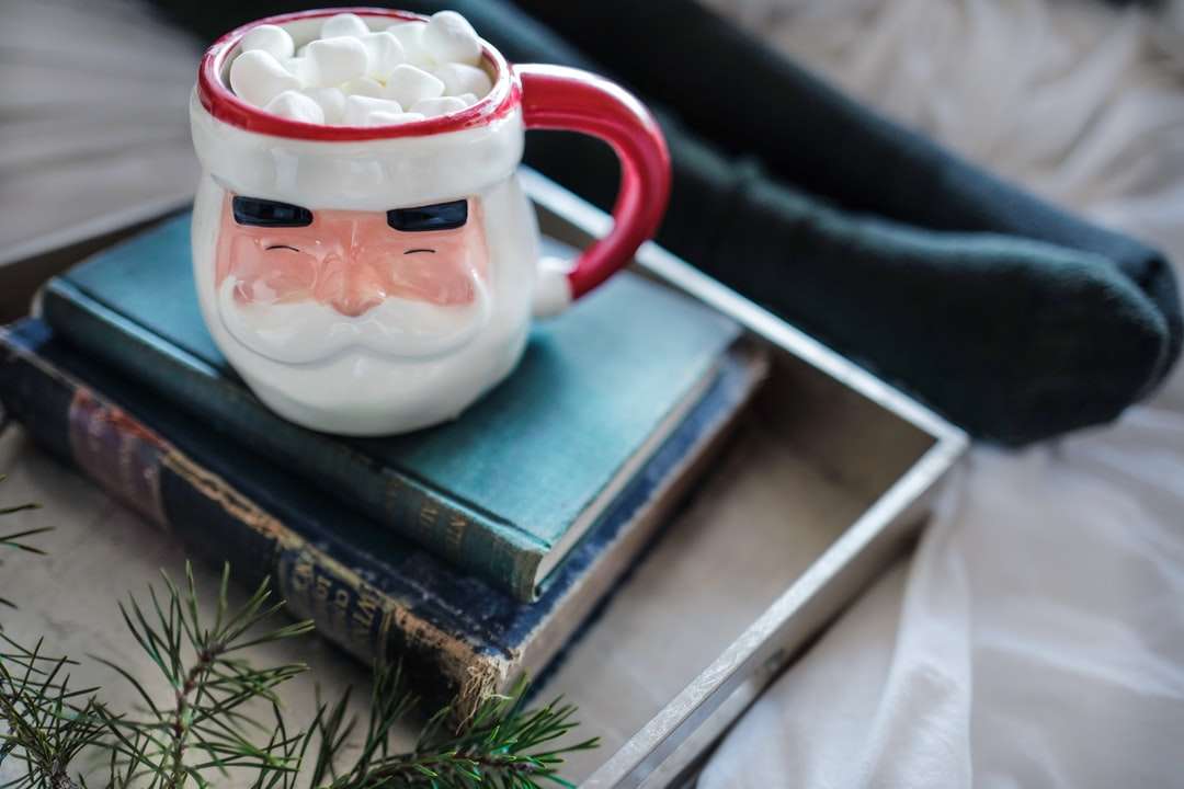 white and red ceramic mug on books jigsaw puzzle online