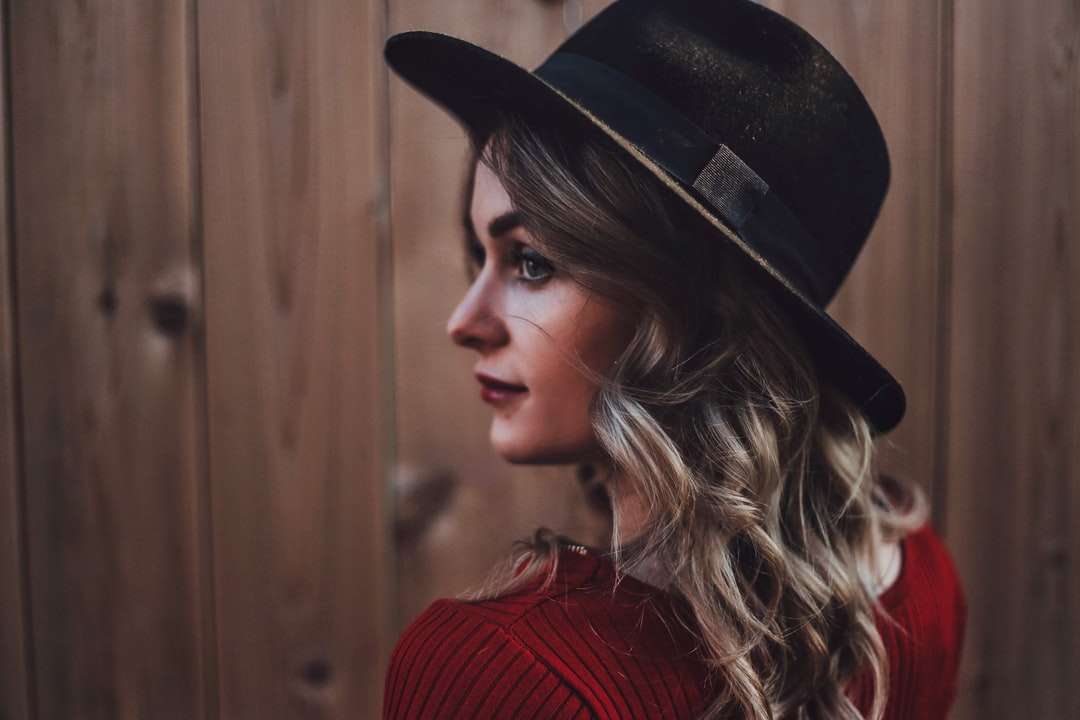 woman in red knit sweater wearing black fedora hat online puzzle