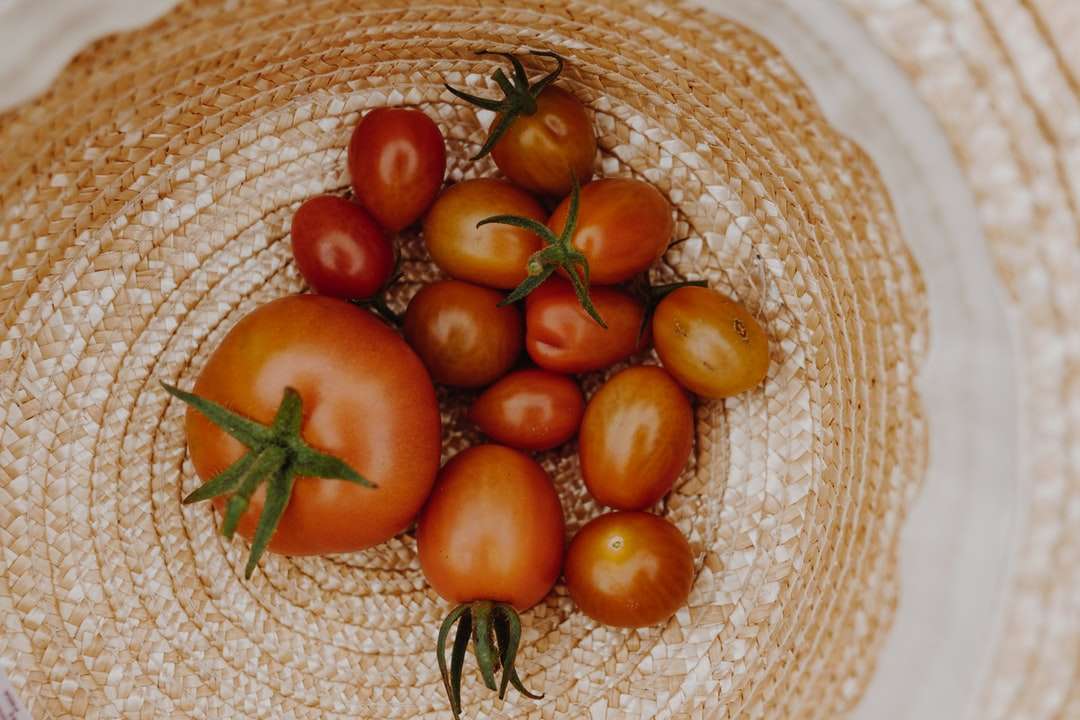 orange and red tomato on brown woven basket jigsaw puzzle online