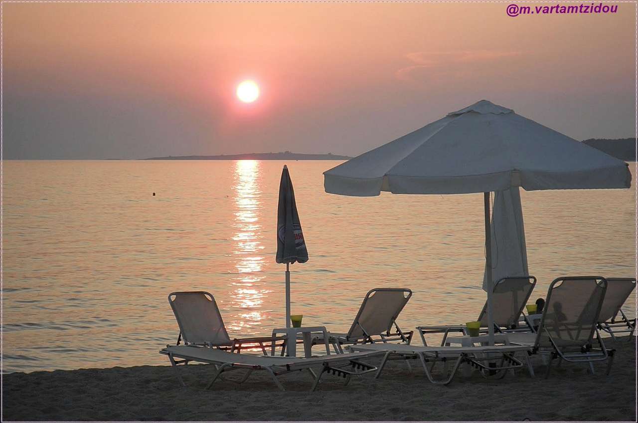 Solnedgång på stranden pussel på nätet