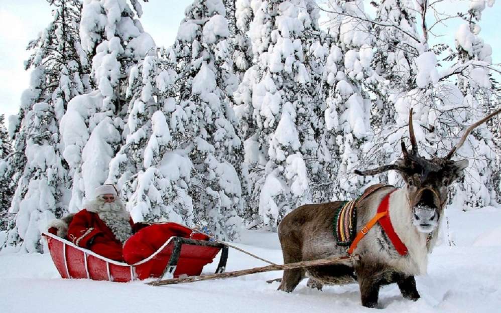 Άγιος Βασίλης με τάρανδο. παζλ online