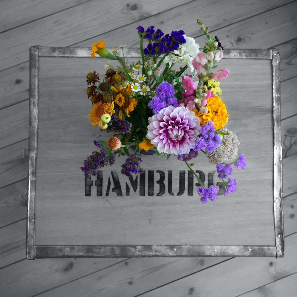 purple and pink flowers on gray wooden board jigsaw puzzle online