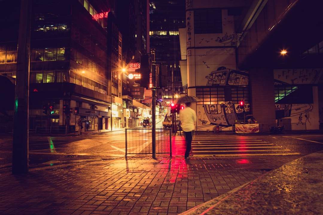 man in white shirt and red pants standing on sidewalk online puzzle