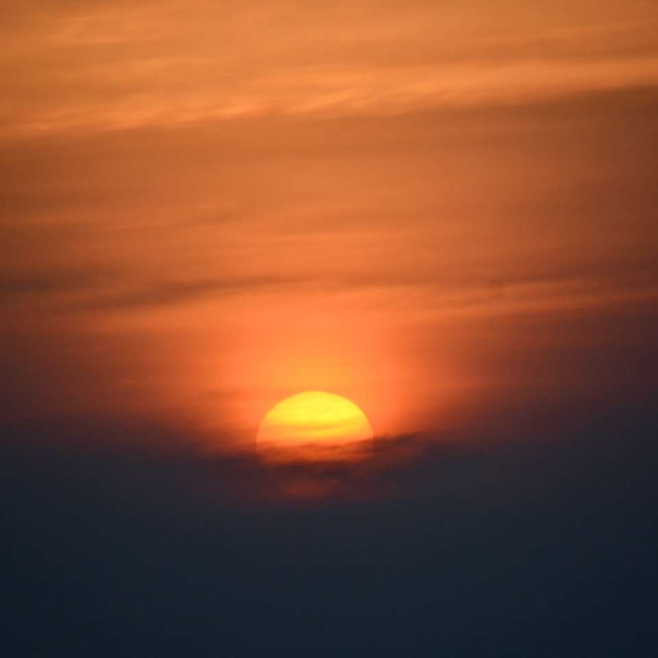 solnedgång över molnen pussel på nätet