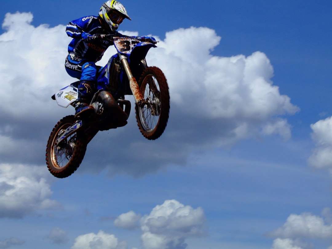 man riding blue and black sports bike online puzzle