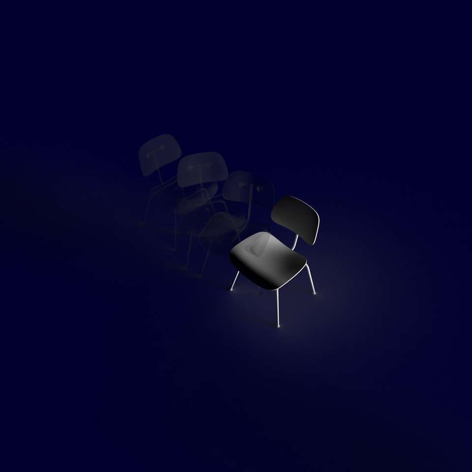 Graustufenfoto von Stühlen auf weißem Raum Online-Puzzle