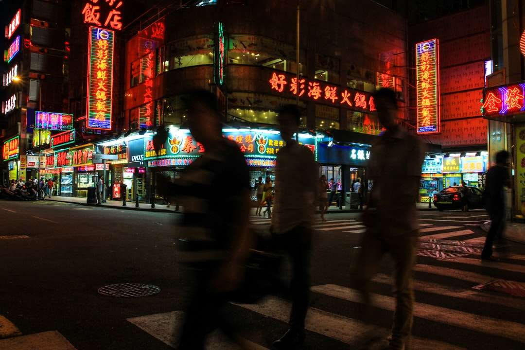 people walking on street during night time jigsaw puzzle online