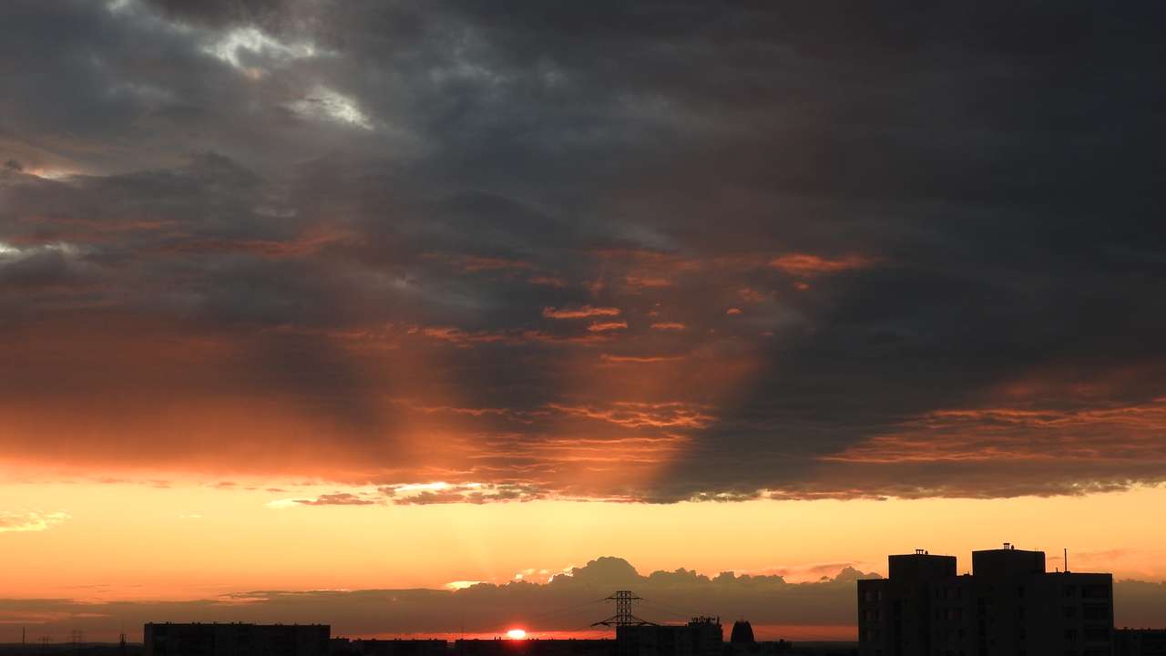 Solnedgång över staden pussel på nätet