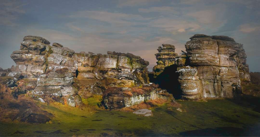 brown rock formation under gray clouds jigsaw puzzle online