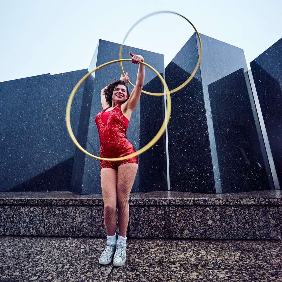 woman in red suit holding hula hoops jigsaw puzzle online