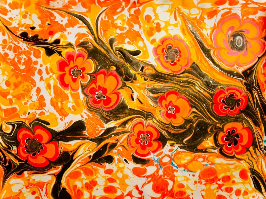 orange och gul blommig textil Pussel online